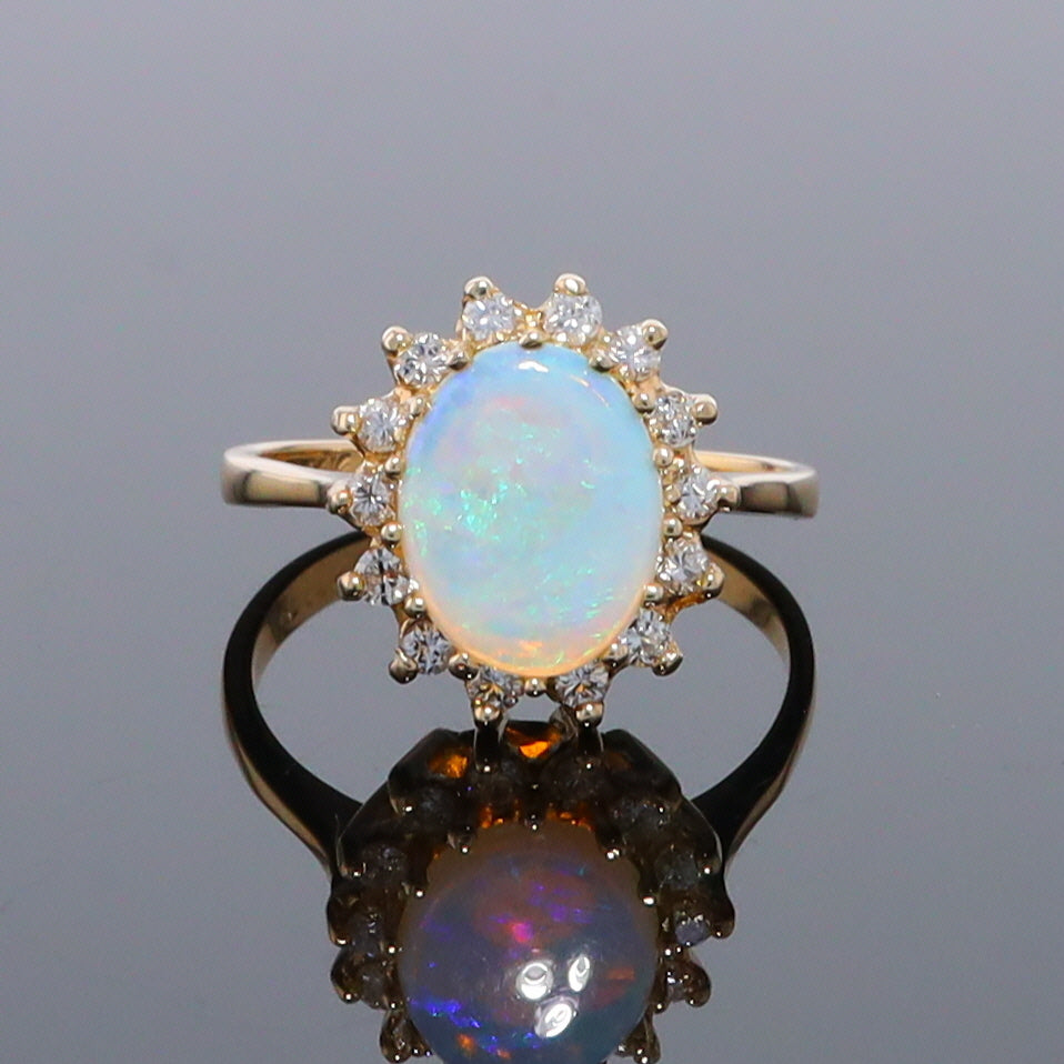 Oval Cabochon Opal with Diamond Halo Ring