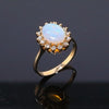 Oval Cabochon Opal with Diamond Halo Ring