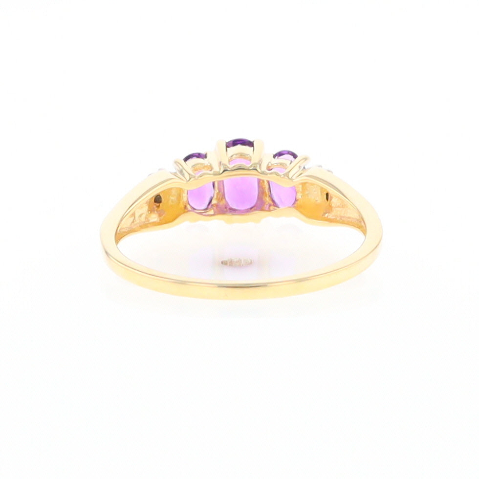 Three stone ring with amethyst