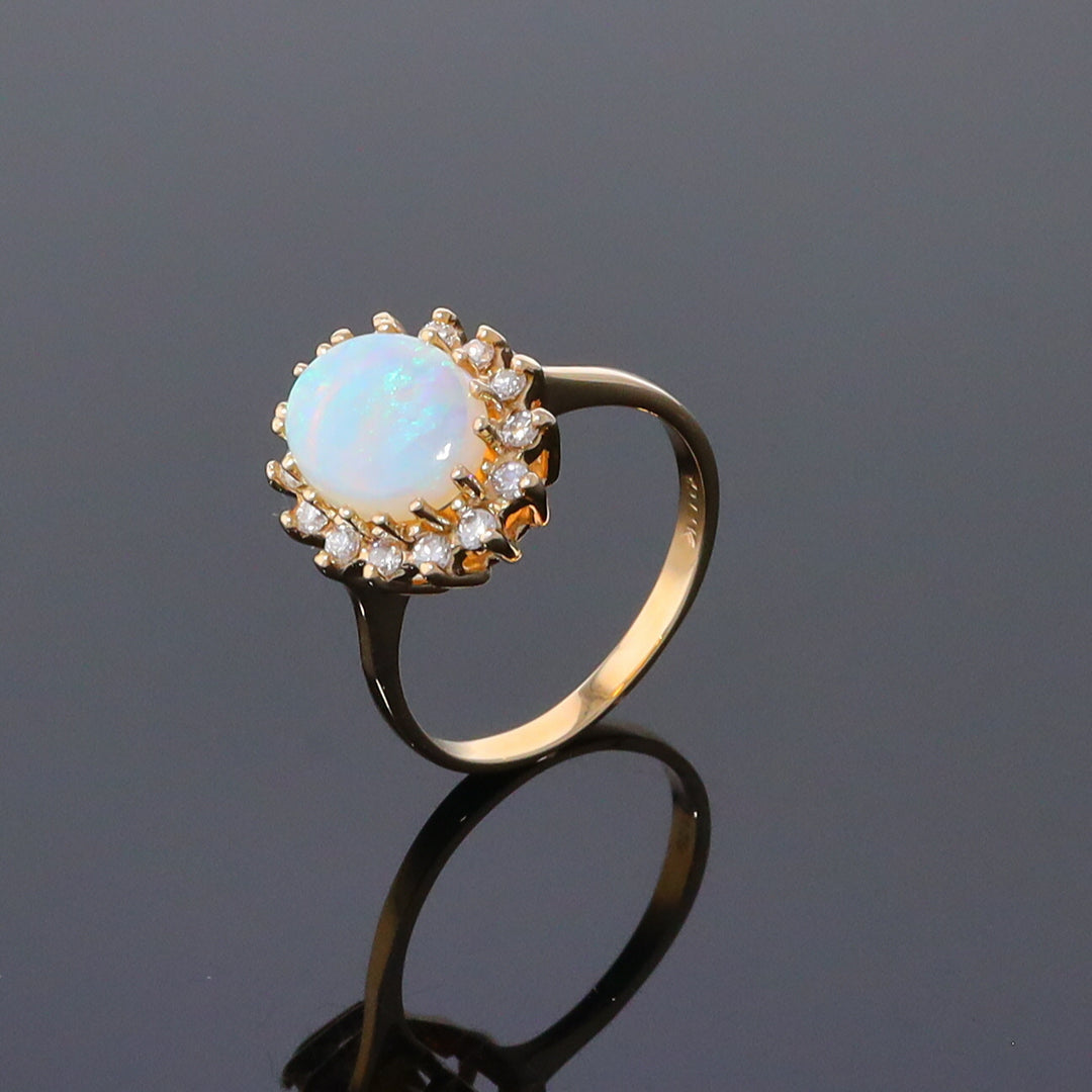 Oval Cabochon Opal with Diamond Halo Ring