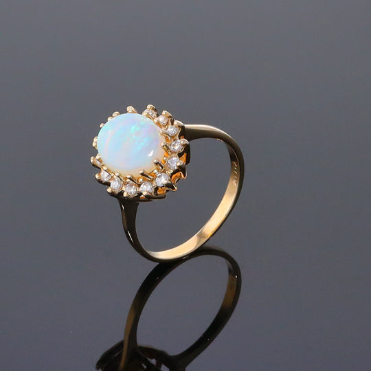 Oval Cabochon Opal with Diamond Halo Ring