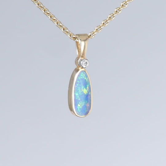 Opal Pendant Oval Inlaid Design with .02ct Round Diamond