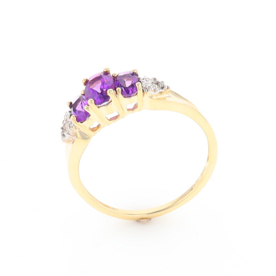 Three stone ring with amethyst