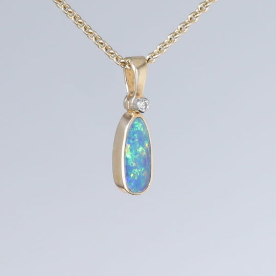 Opal Pendant Oval Inlaid Design with .02ct Round Diamond