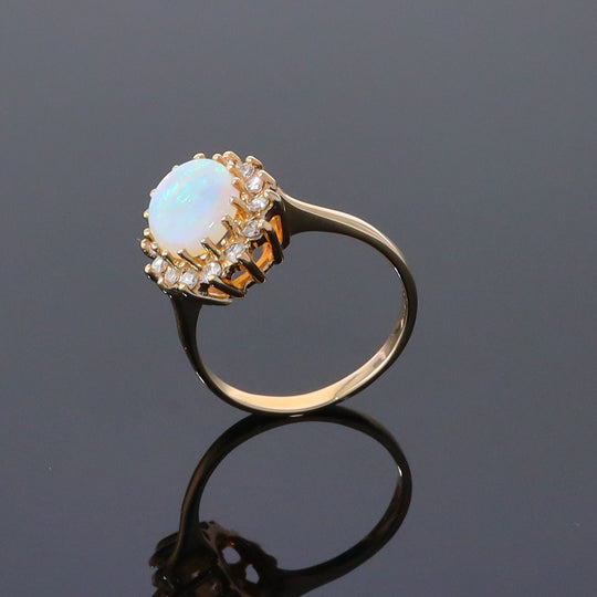 Oval Cabochon Opal with Diamond Halo Ring