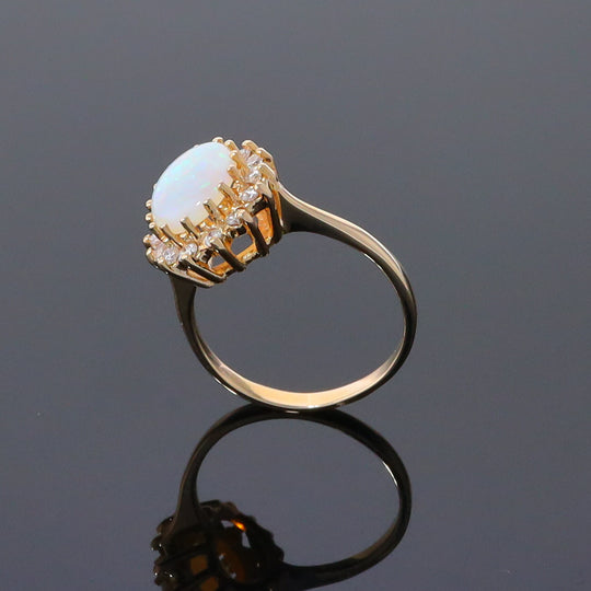 Oval Cabochon Opal with Diamond Halo Ring