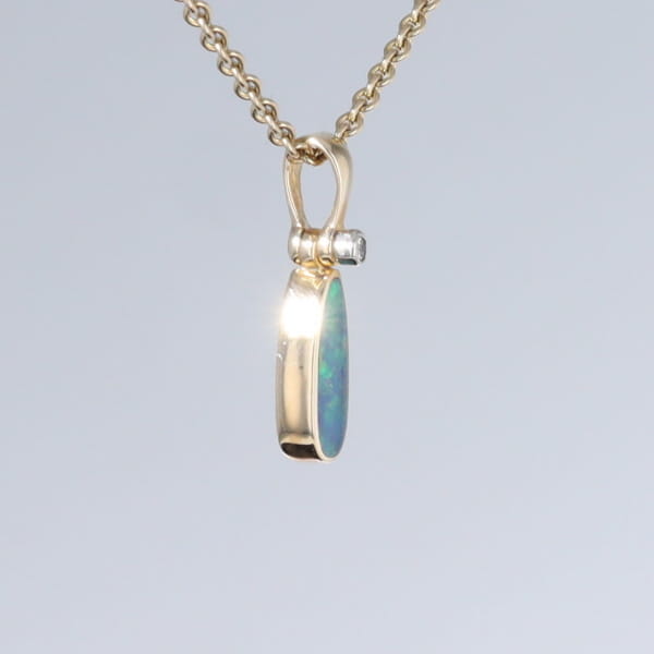 Opal Pendant Oval Inlaid Design with .02ct Round Diamond