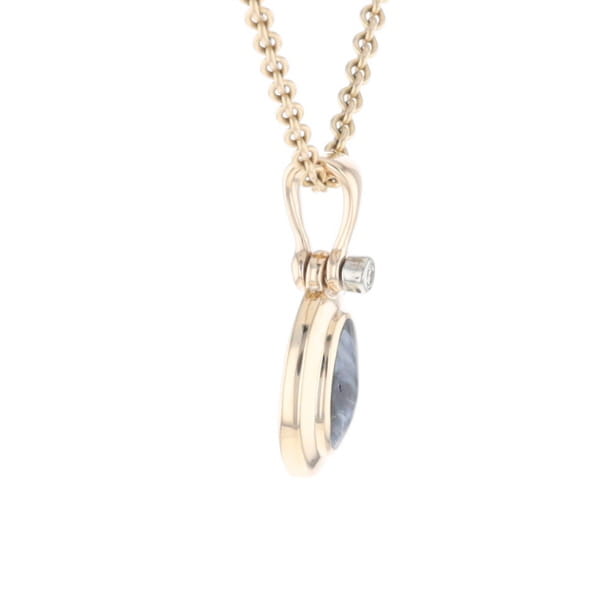 Natural pietersite oval inlaid .02ctw diamond pendant