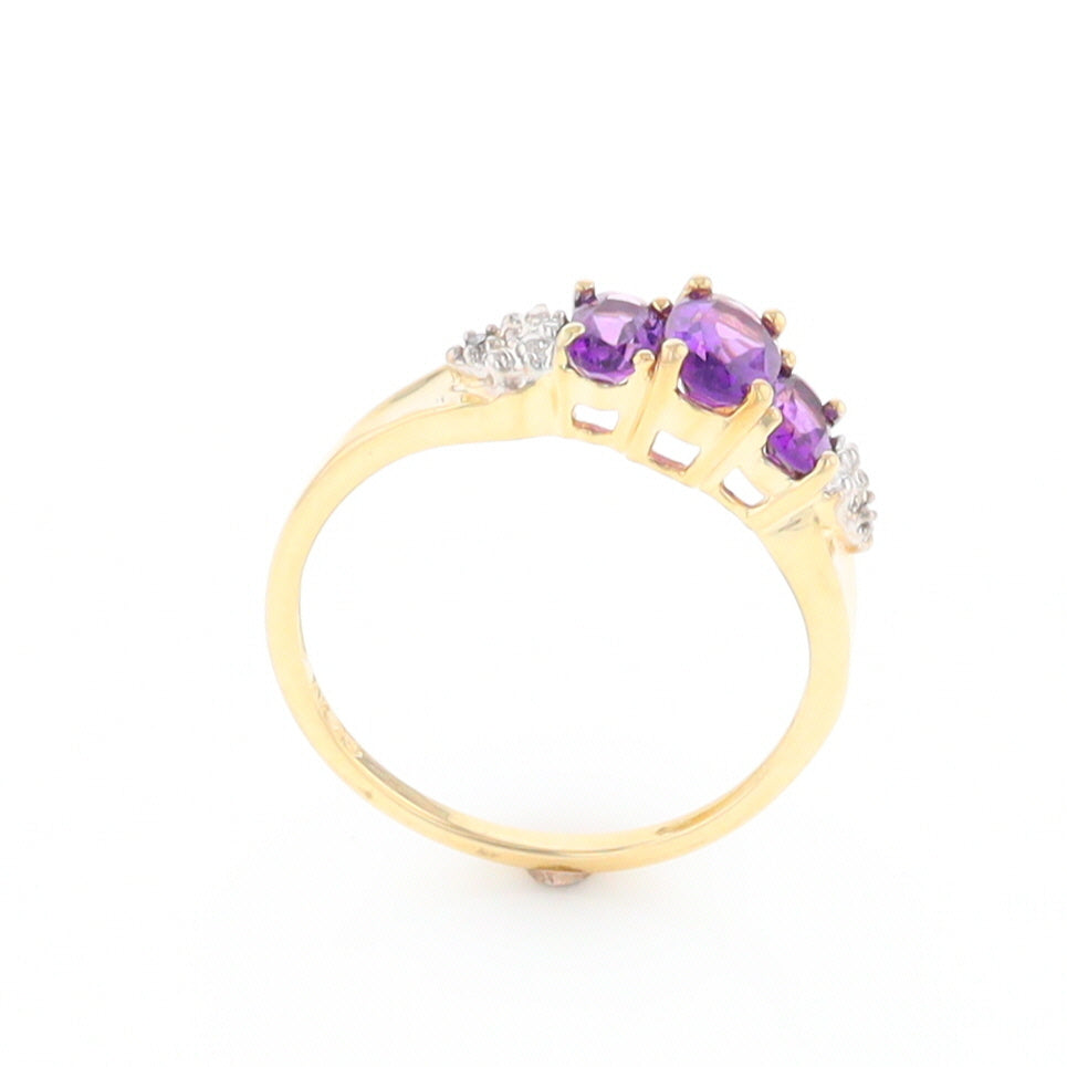 Three stone ring with amethyst