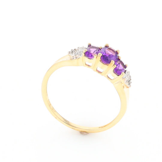 Three stone ring with amethyst