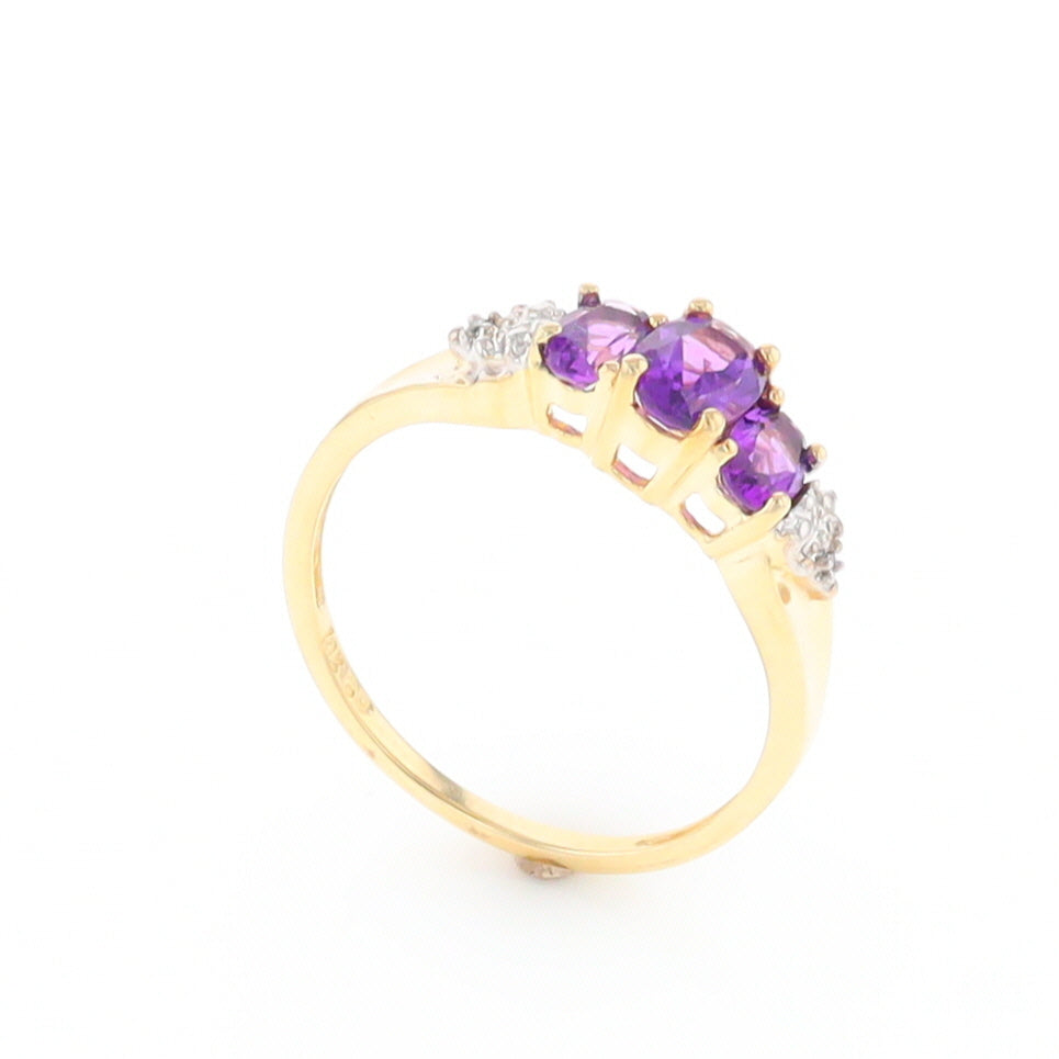 Three stone ring with amethyst