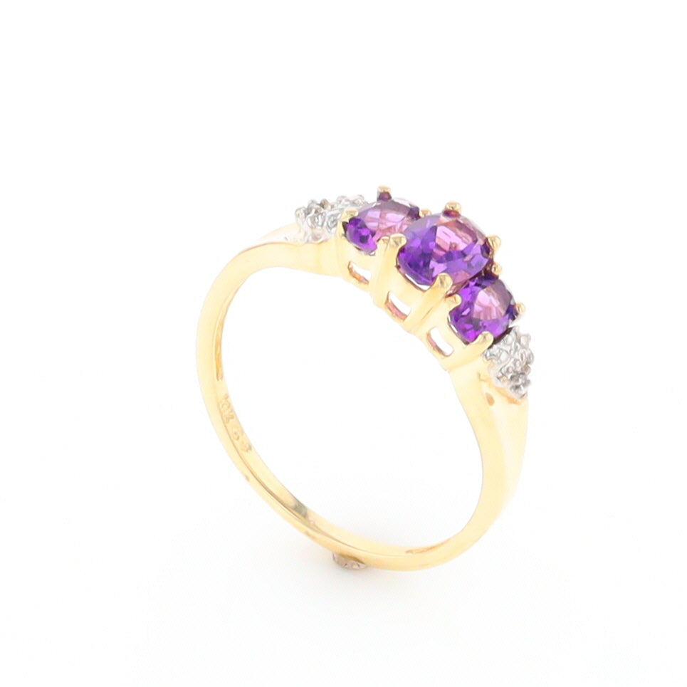 Three stone ring with amethyst