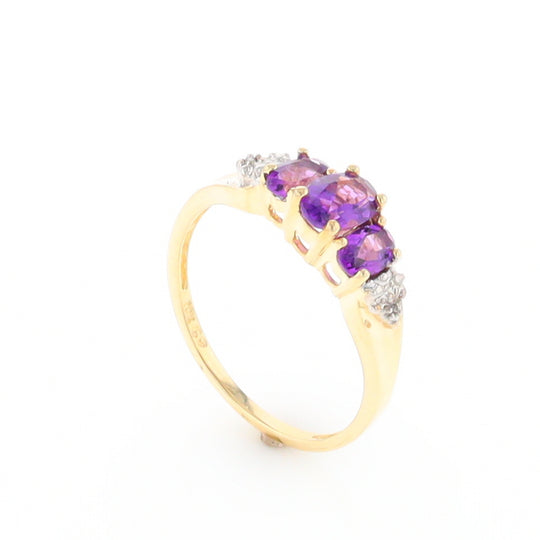 Three stone ring with amethyst