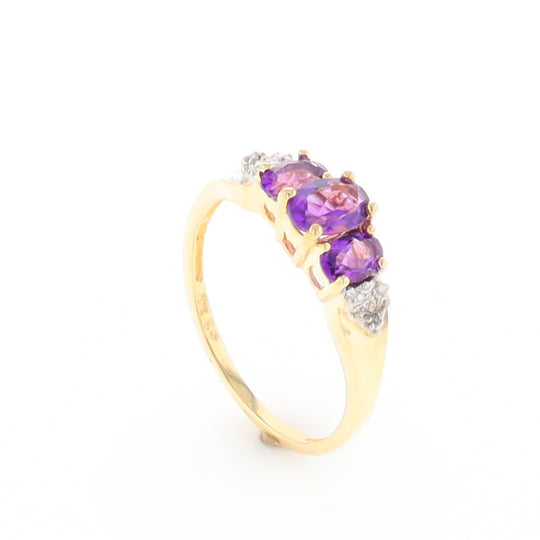 Three stone ring with amethyst