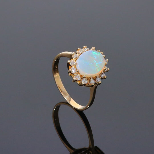 Oval Cabochon Opal with Diamond Halo Ring