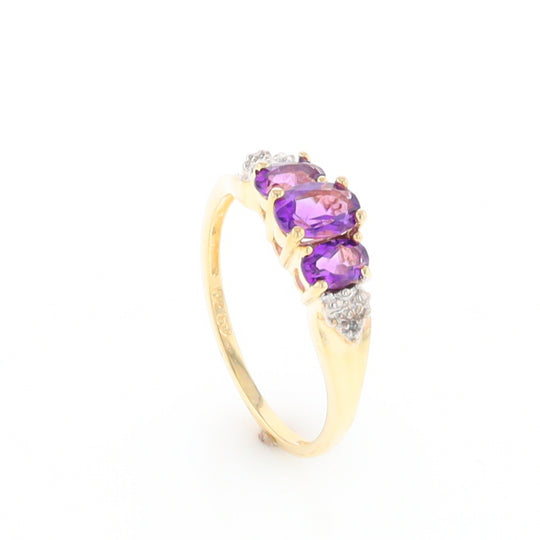 Three stone ring with amethyst