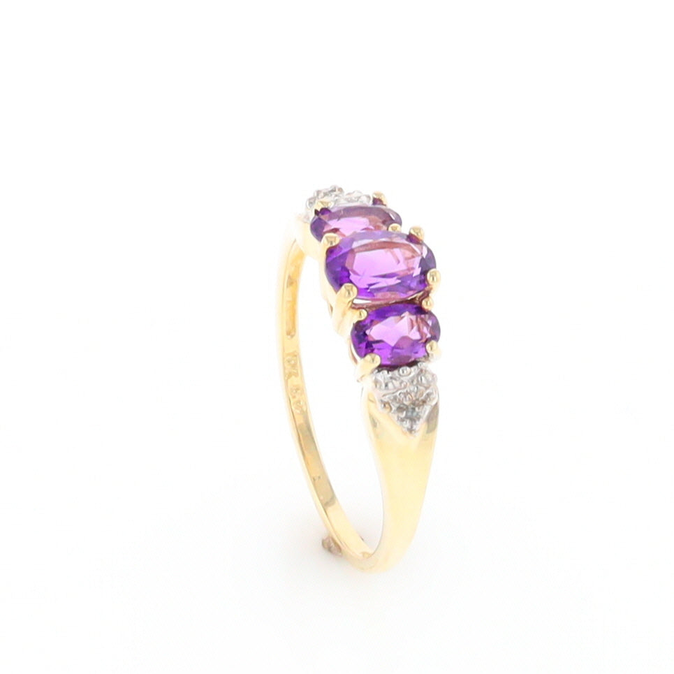 Three stone ring with amethyst