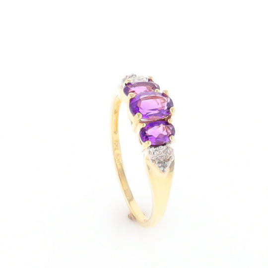 Three stone ring with amethyst