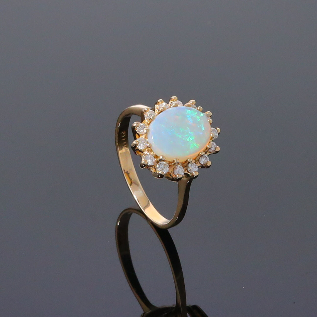 Oval Cabochon Opal with Diamond Halo Ring