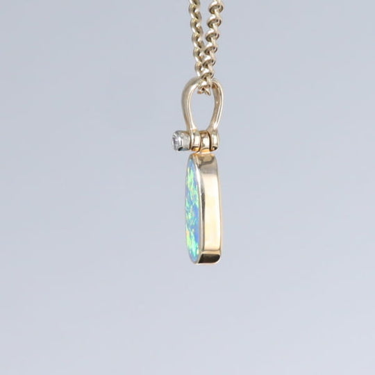 Opal Pendant Oval Inlaid Design with .02ct Round Diamond