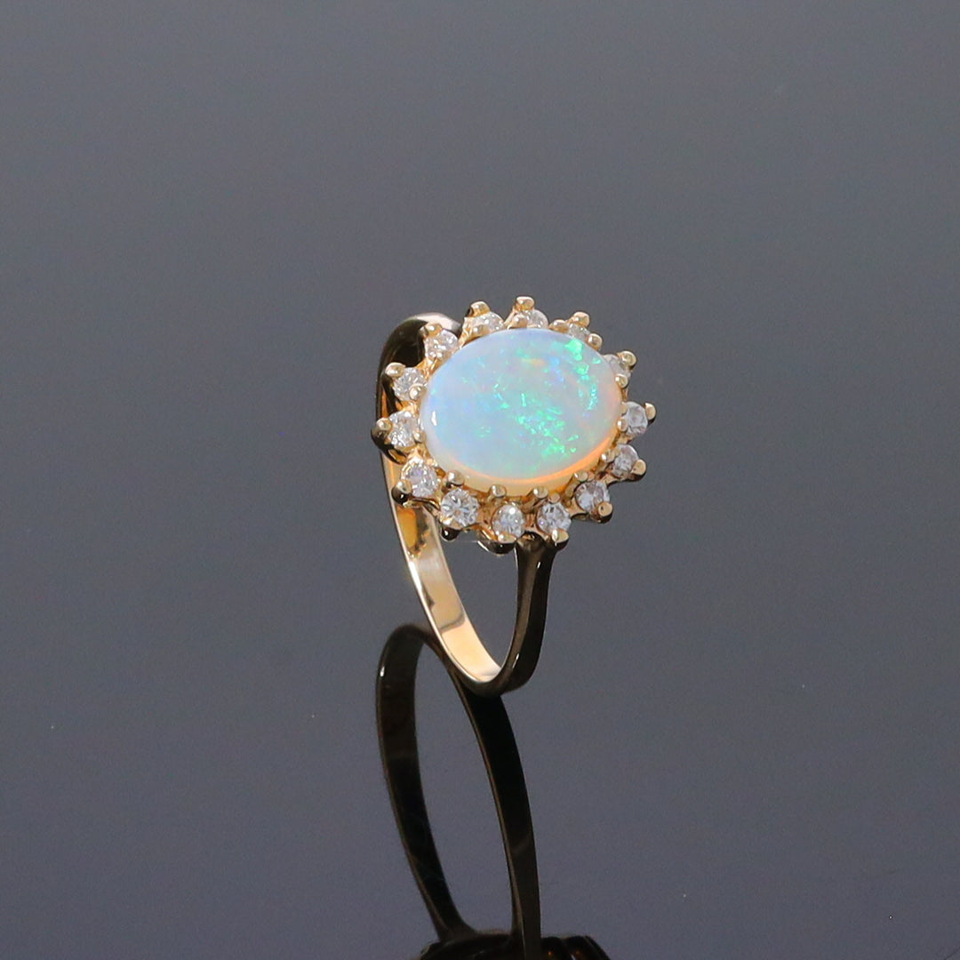 Oval Cabochon Opal with Diamond Halo Ring