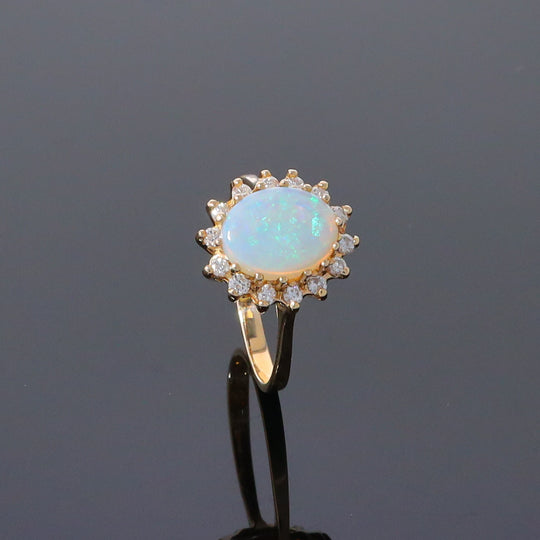 Oval Cabochon Opal with Diamond Halo Ring