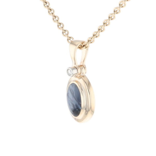 Natural pietersite oval inlaid .02ctw diamond pendant