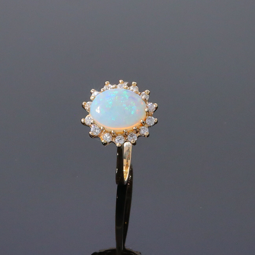 Oval Cabochon Opal with Diamond Halo Ring