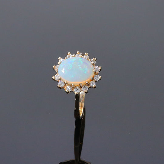 Oval Cabochon Opal with Diamond Halo Ring