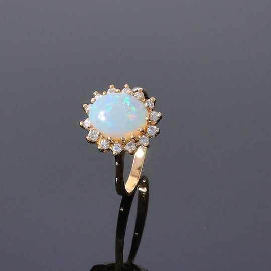 Oval Cabochon Opal with Diamond Halo Ring