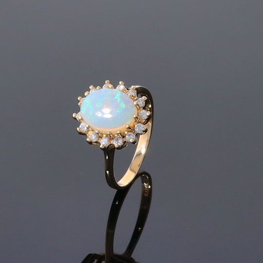 Oval Cabochon Opal with Diamond Halo Ring