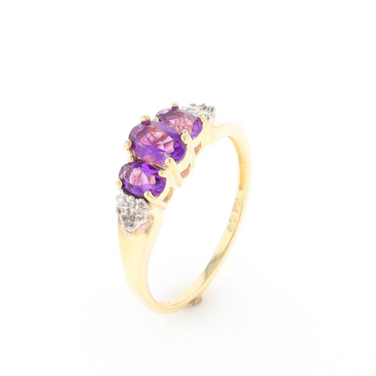 Three stone ring with amethyst