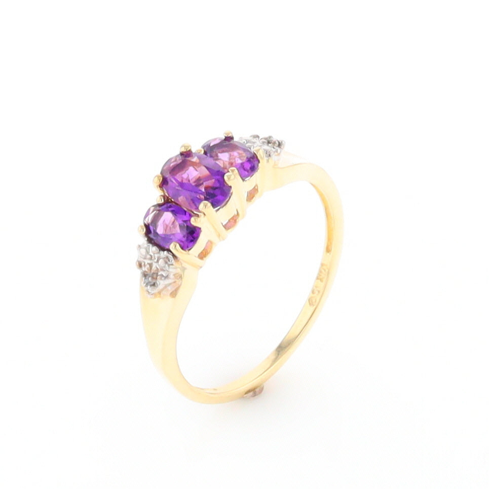 Three stone ring with amethyst