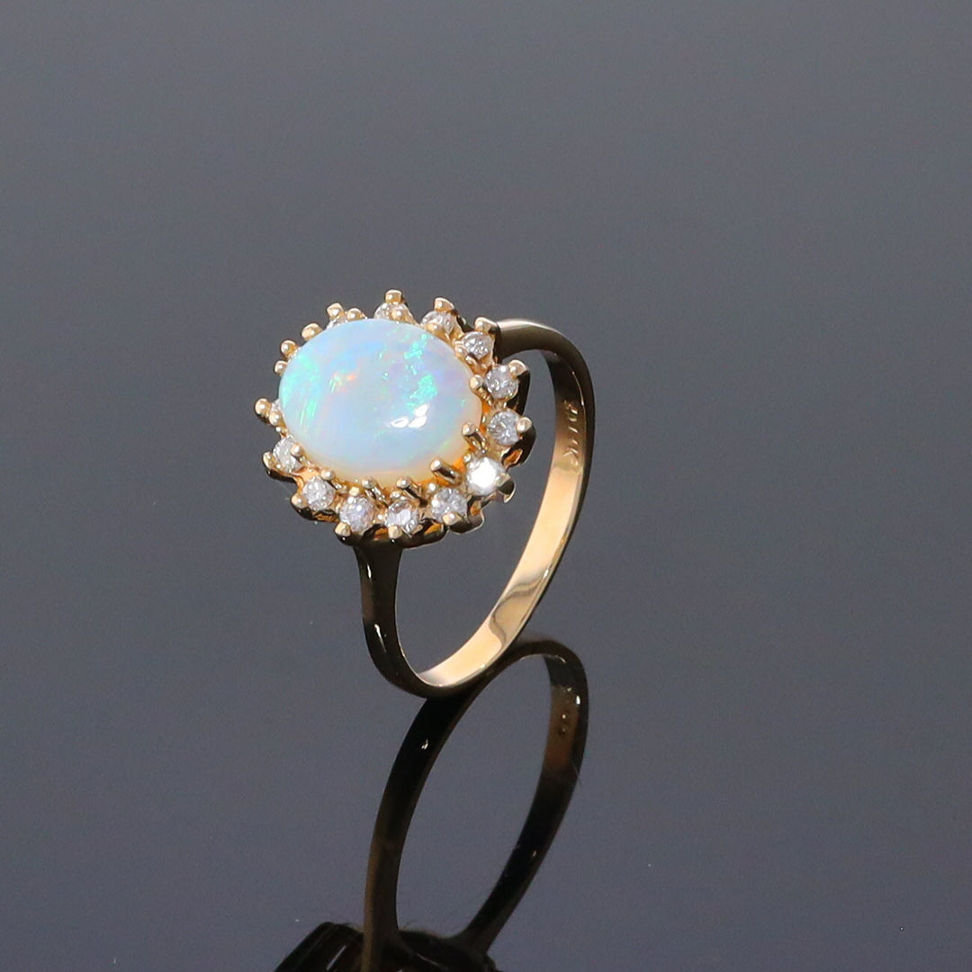 Oval Cabochon Opal with Diamond Halo Ring