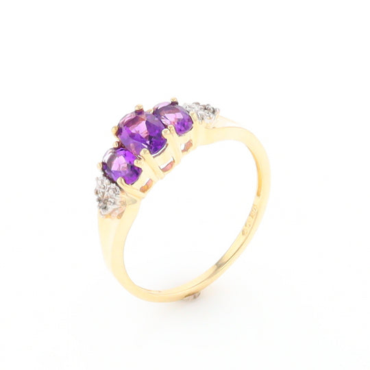 Three stone ring with amethyst